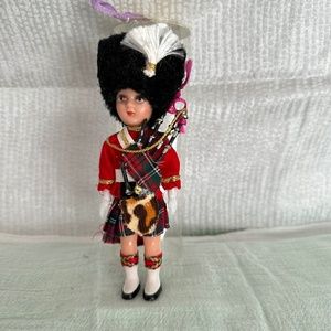 Vintage Scottish souvenir/ collectible doll with bag pipes.